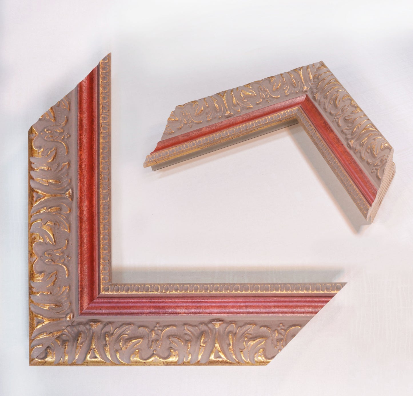 Antique gold picture frame on grey pink background with red stripe in classic style. 2.13" wide x 1.34" high.