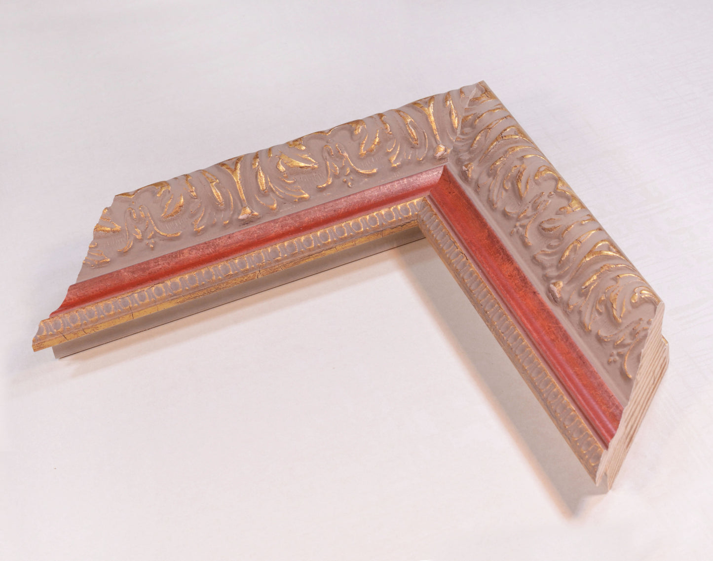 Antique gold picture frame on grey pink background with red stripe in classic style. 2.13" wide x 1.34" high.