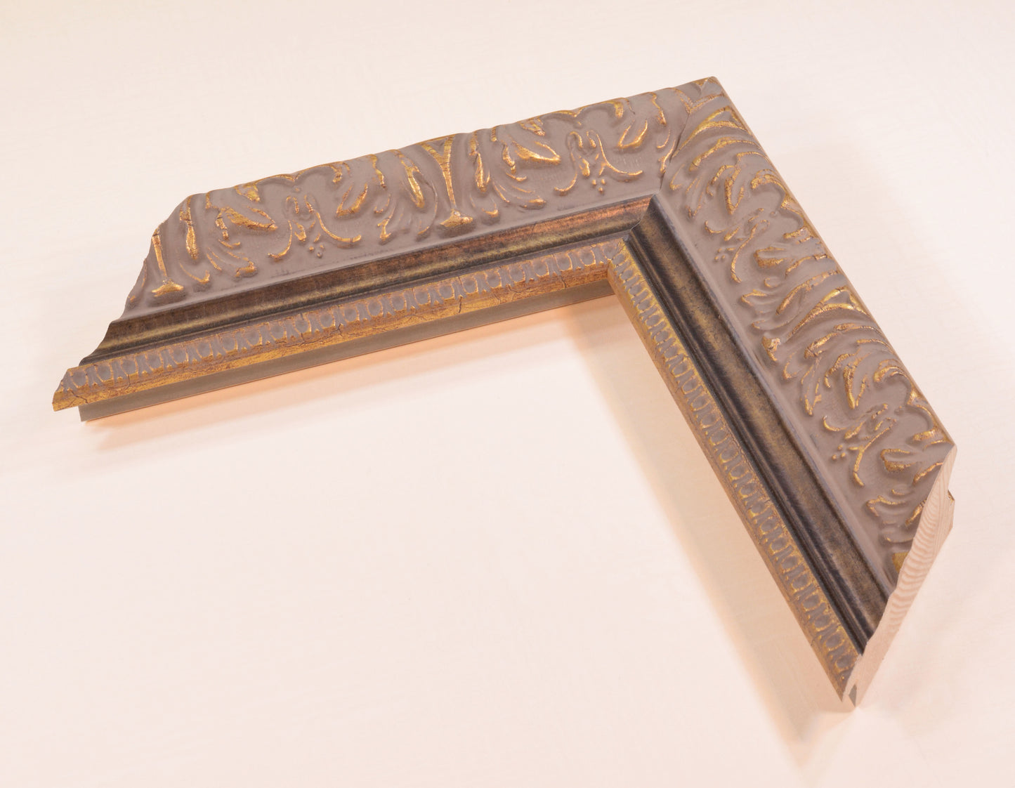 Antique Gold Picture Frame on rich gray background with black stripe in classic style. Width 2.13" x Height 1.34".