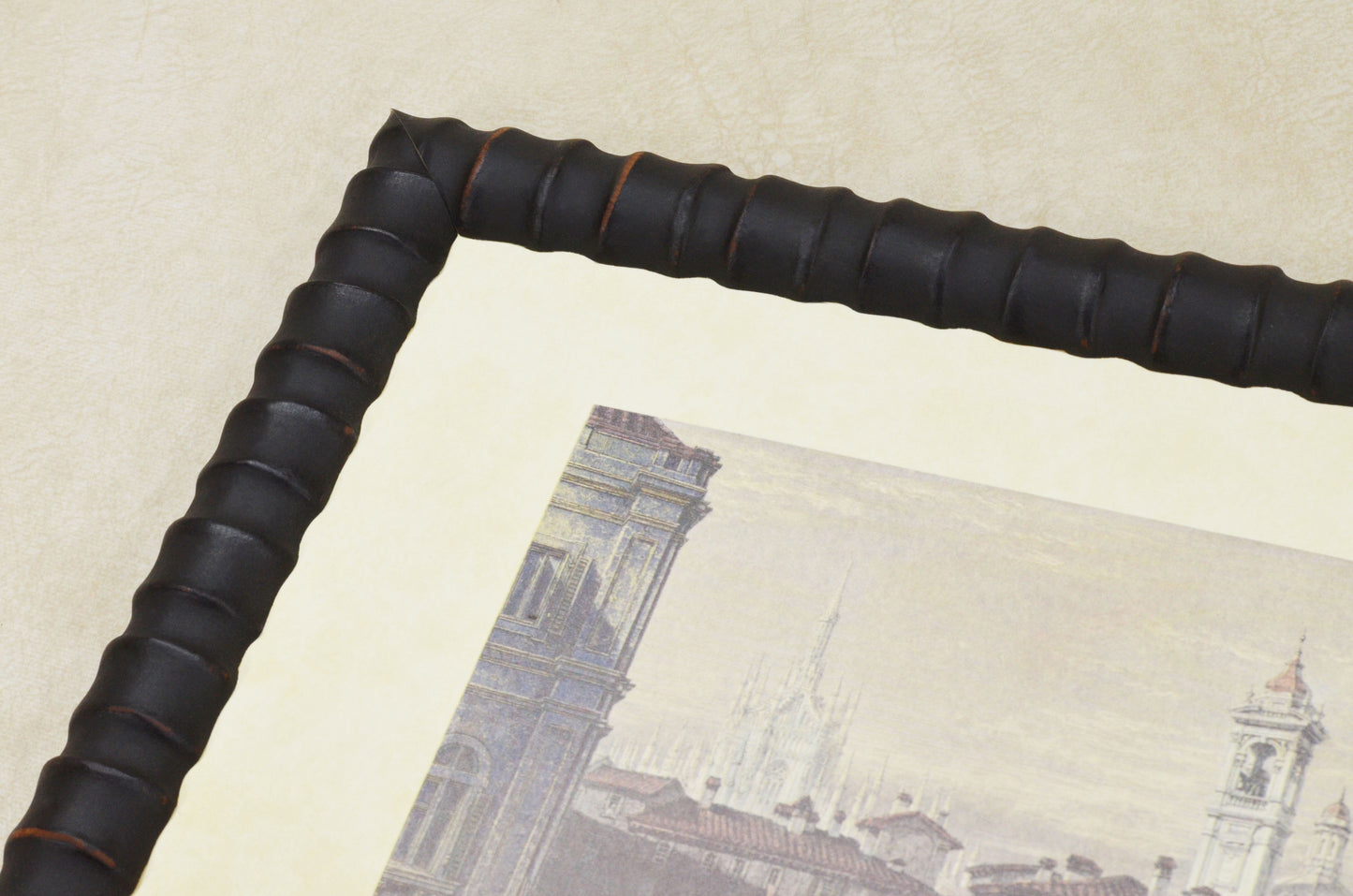Unusual embossed wooden frame in black, 1.1 inches wide, 0.9 inches high.
