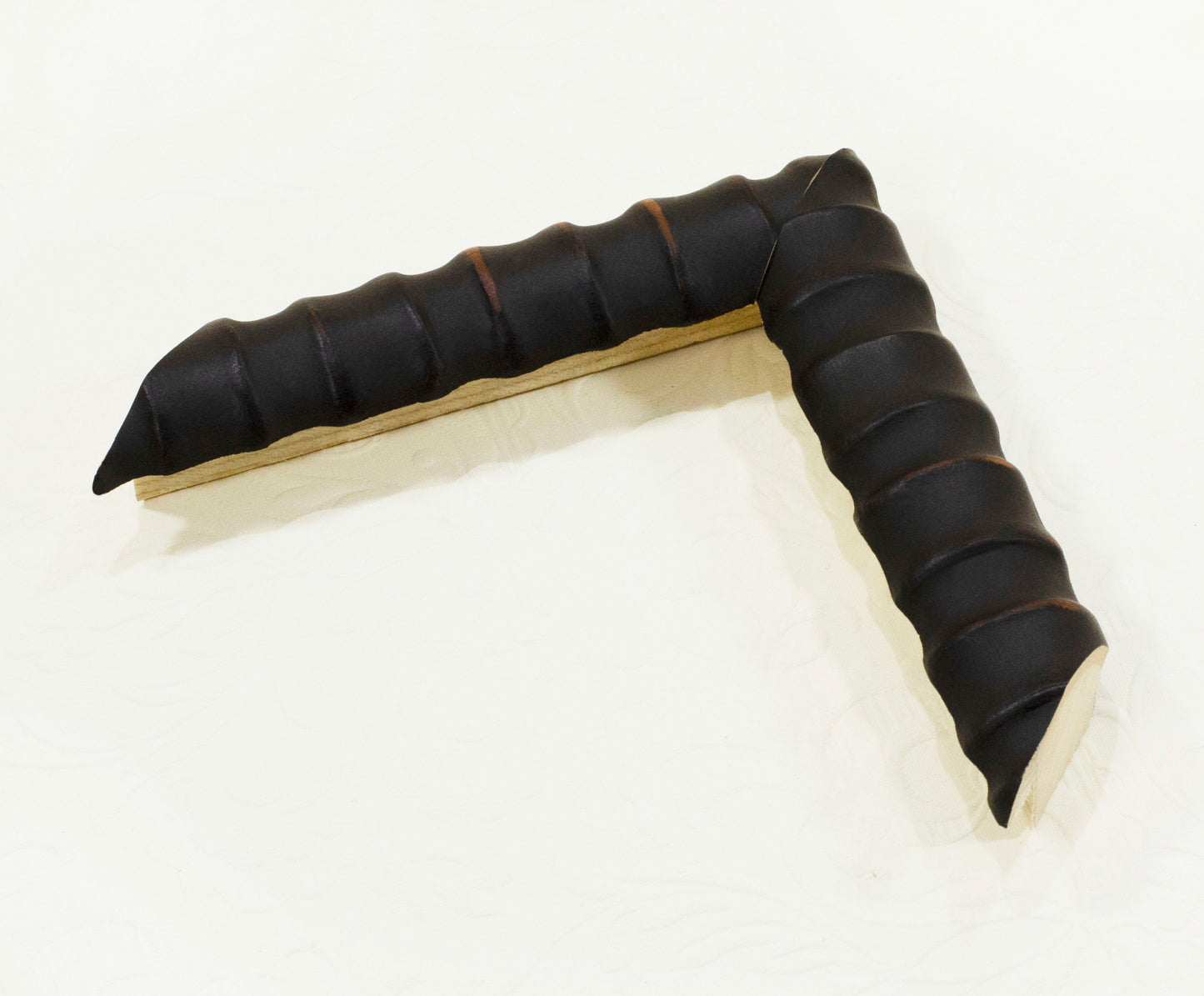 Unusual embossed wooden frame in black, 1.1 inches wide, 0.9 inches high.