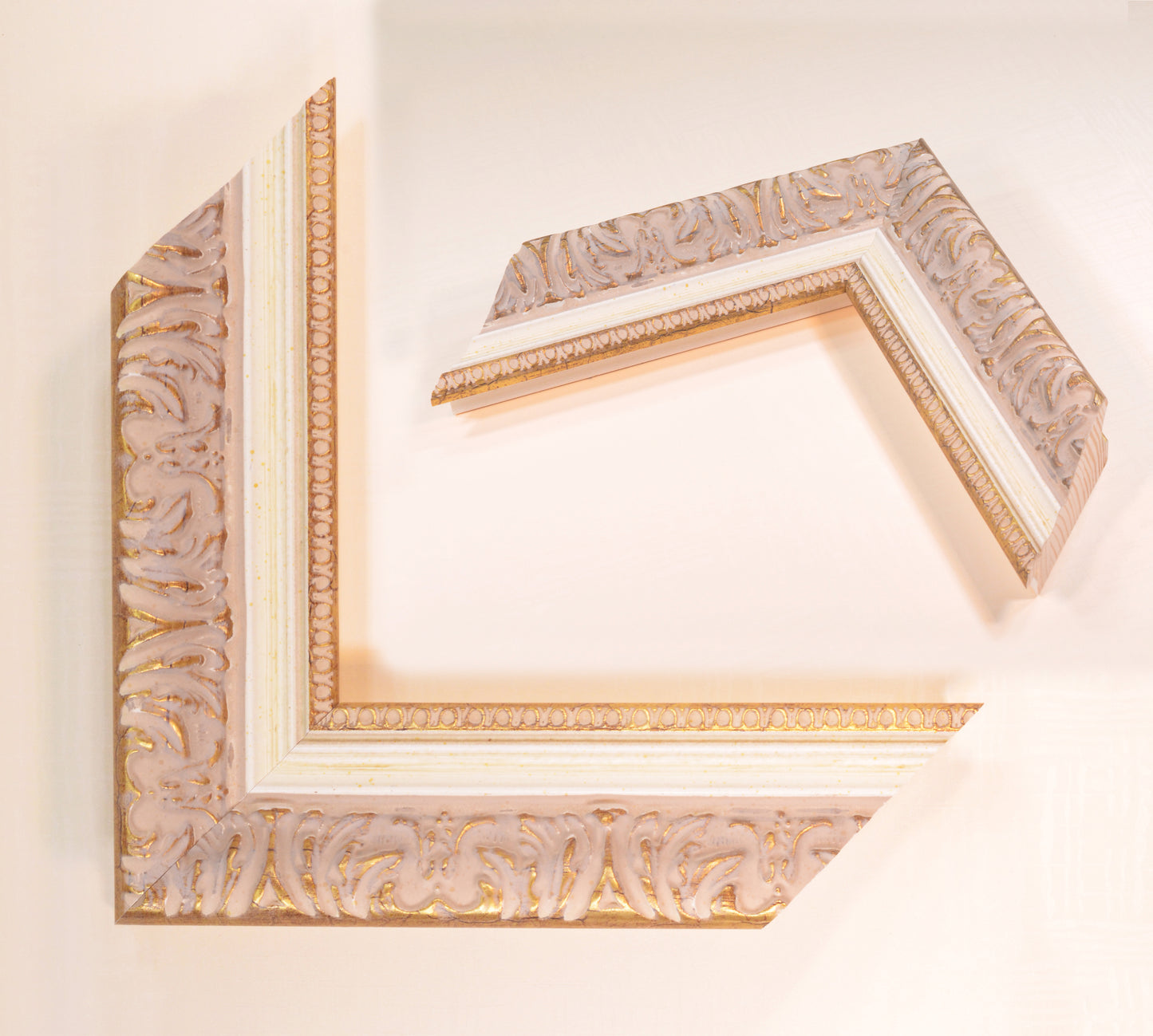 Antique gold picture frame on beige pink background with beige stripe in classic style. Width 2.13 inches, Height 1.34 inches.