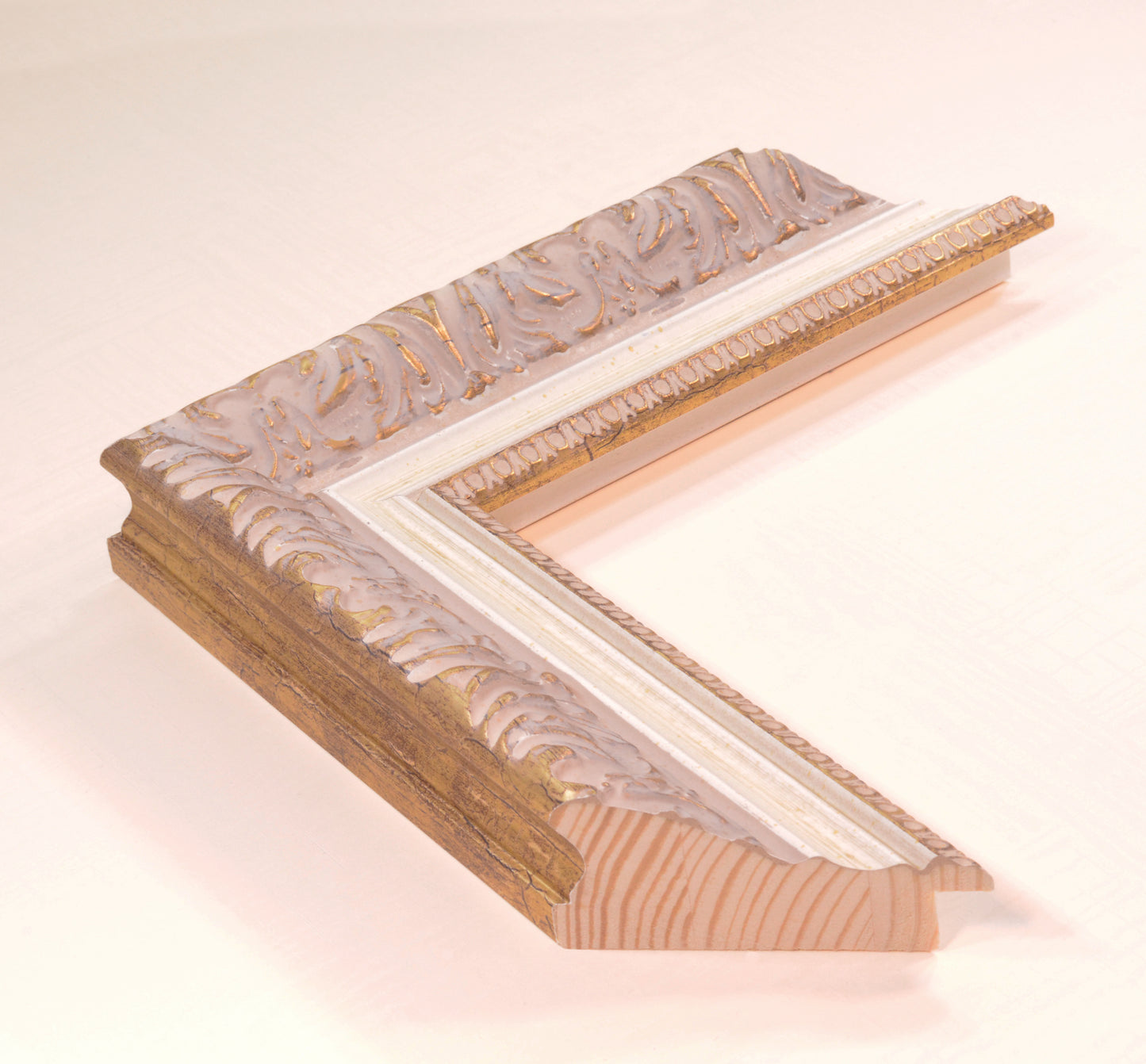 Antique gold picture frame on beige pink background with beige stripe in classic style. Width 2.13 inches, Height 1.34 inches.