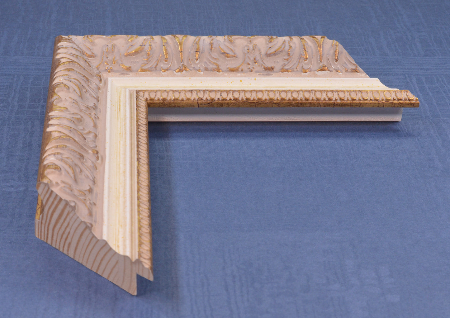 Antique gold picture frame on beige pink background with beige stripe in classic style. Width 2.13 inches, Height 1.34 inches.